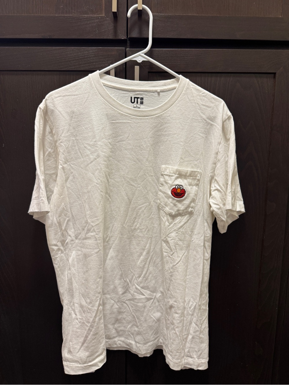 Men’s Uniqlo x KAWS x Sesame Street White Pocket Tee with Red Character Patch